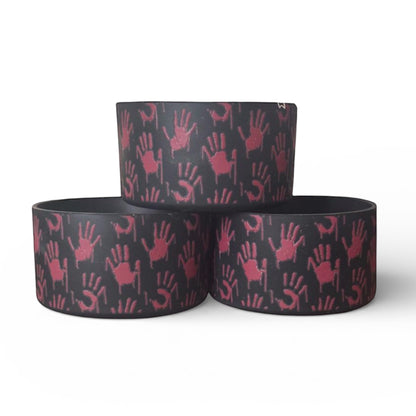 Next Nirvana Don't Be So Serial silicone tumbler boot with red 3D handprint pattern on a black non-slip base.