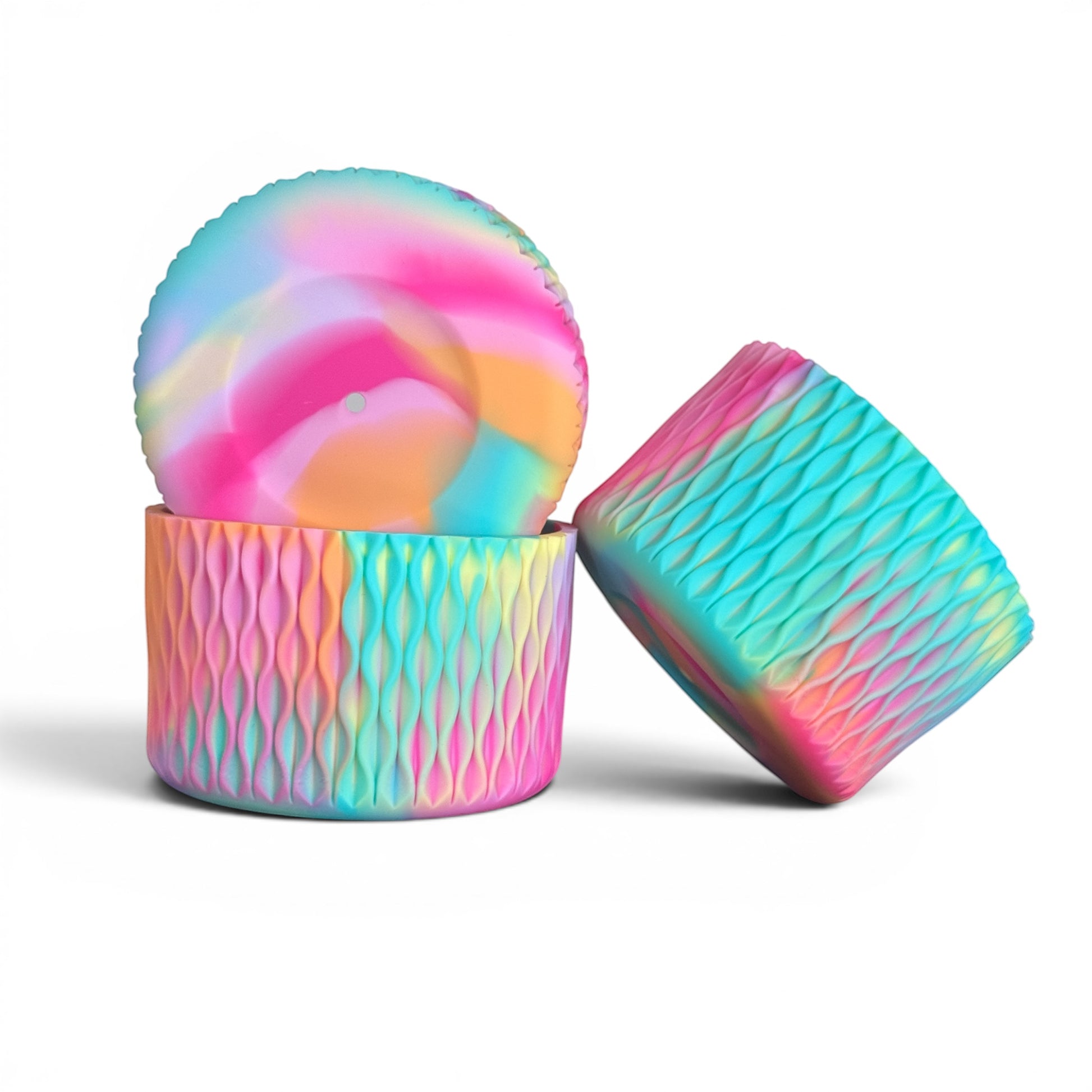 Next Nirvana silicone tumbler boot and straw topper set in a matte, multi-colored pastel wave pattern.