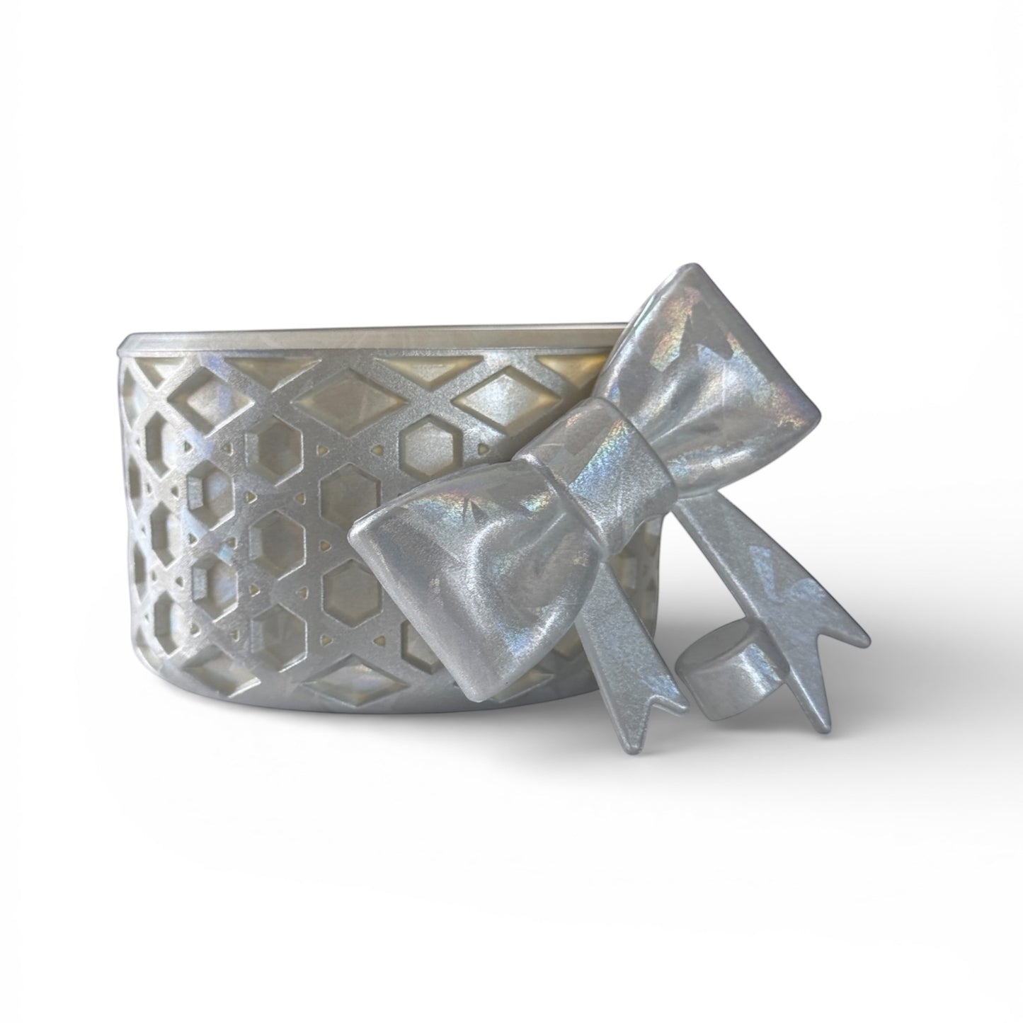 Next Nirvana silver silicone tumbler boot and matching 3D bow straw topper with a textured waffle pattern