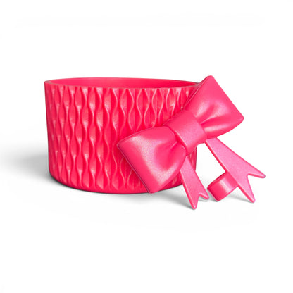 Next Nirvana Slayberry Punch shimmer pink silicone tumbler boot with matching 3D bow straw topper for drinkware.