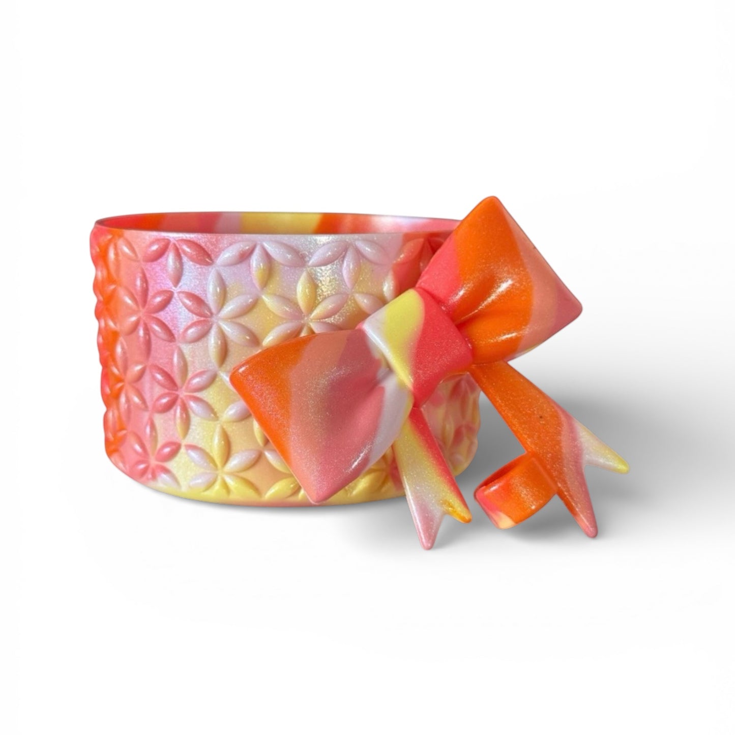 Next Nirvana Summer Heat Shimmer silicone tumbler boot and matching 3D bow straw topper in pink, orange, and yellow.