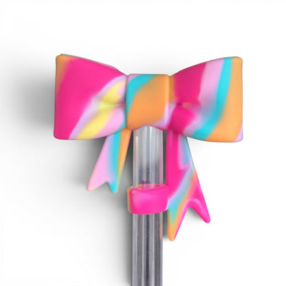 Next Nirvana Summer Splash 3D silicone bow straw topper in a vibrant multi-color swirl pattern on a clear straw.
