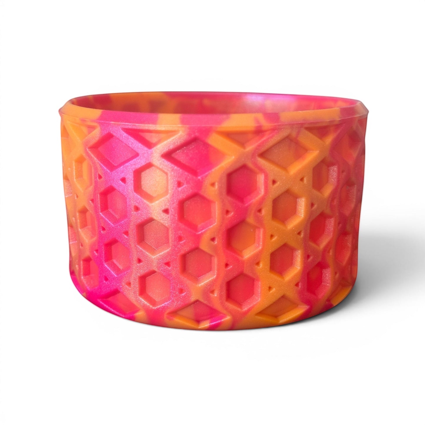 Next Nirvana Summer Sunset shimmer silicone tumbler boot with a textured waffle pattern in pink and orange.