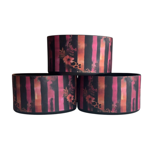 Next Nirvana Sunset Stripes silicone tumbler boot with pink, orange, and black vertical brushstroke floral pattern.
