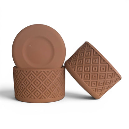 Next Nirvana tan silicone tumbler boot with a geometric diamond texture for protective non-slip grip on water bottles.