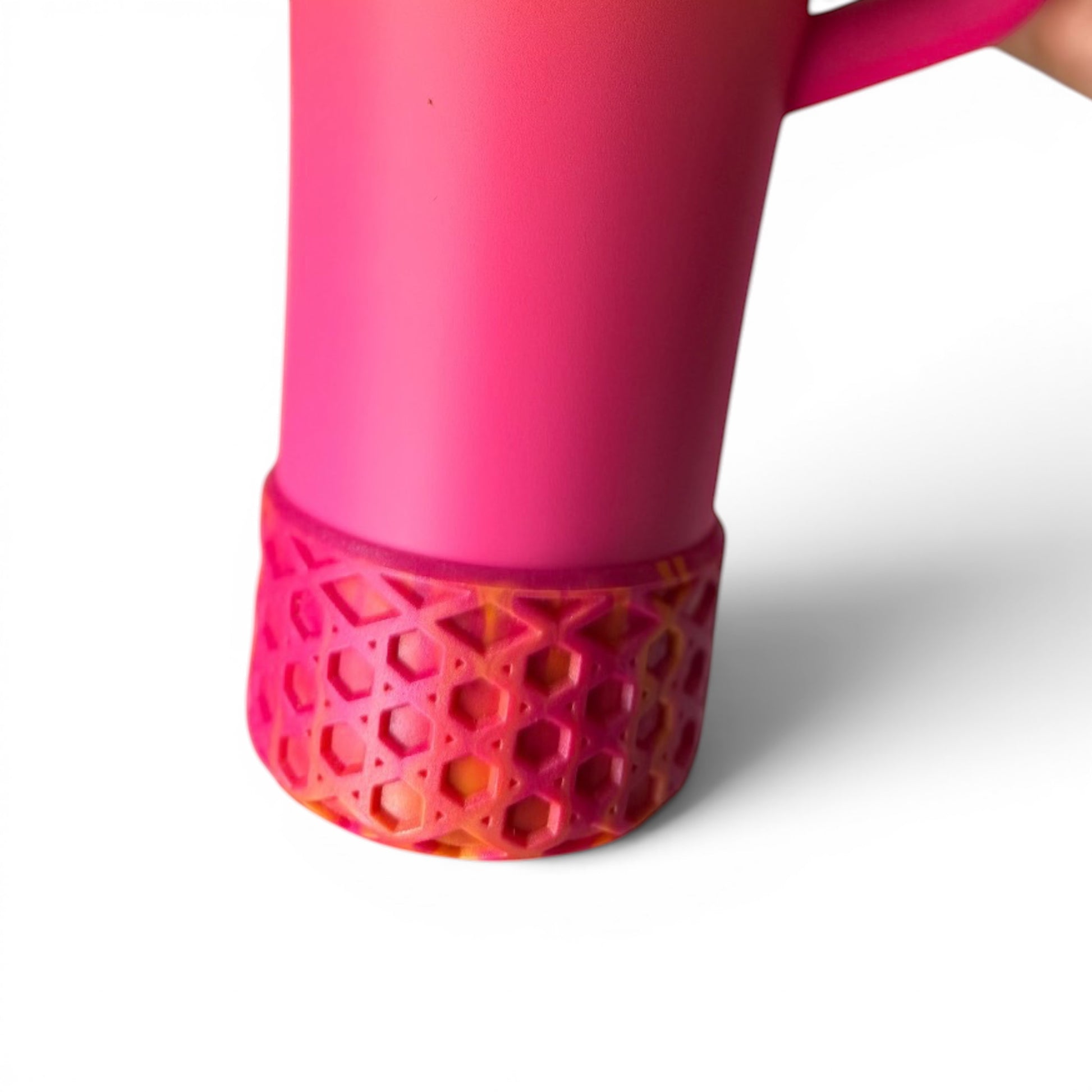 Next Nirvana Summer Sunset shimmer waffle silicone tumbler boot on a pink cup for scratch protection.