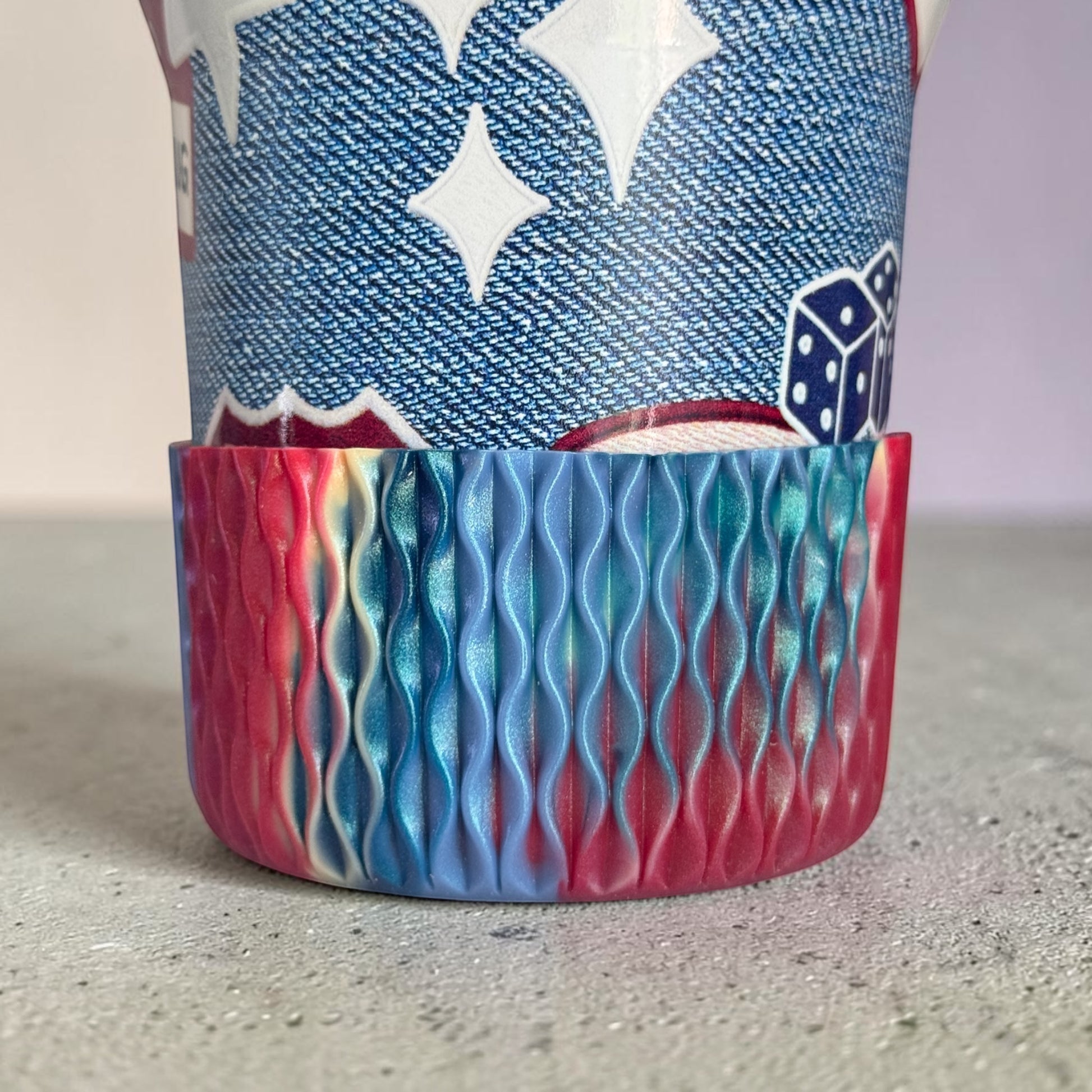 Next Nirvana silicone tumbler boot in a red, blue, and teal wavy 3D texture for 20-40oz insulated drinkware